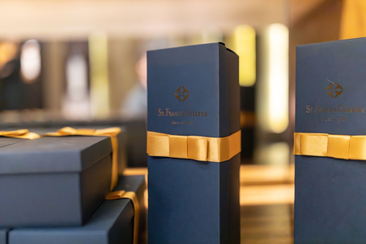 services-03 Sophisticated gift boxes with yellow ribbons promoting luxury merchandise.
